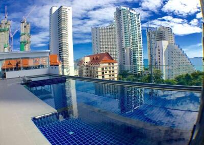 Skyscrapers and buildings view from a rooftop pool