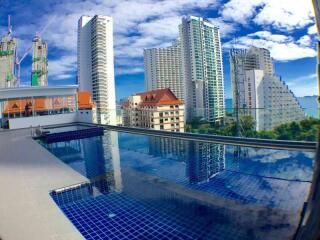 Skyscrapers and buildings view from a rooftop pool