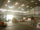 Spacious warehouse with high ceiling and storage areas