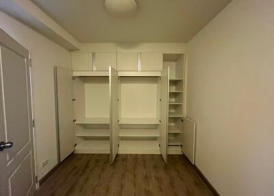 Empty bedroom with open closet storage