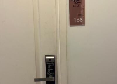 Entrance to a room with an electronic lock and room number 168