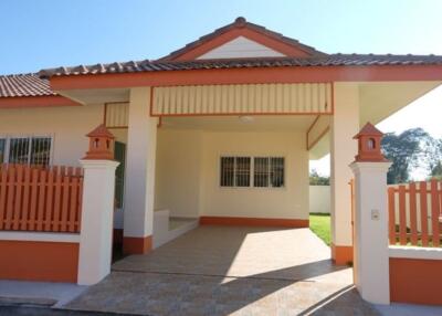 Modern house exterior with a tiled roof and a gated front porch