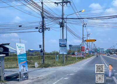 Street view with signs and buildings in the background