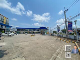 Large commercial building with ample parking