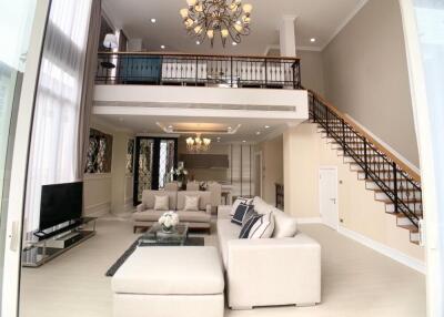 Spacious living room with high ceilings and modern decor