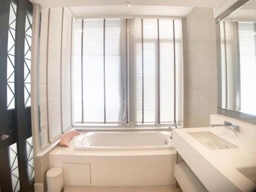 Modern bathroom with bathtub and sleek sink