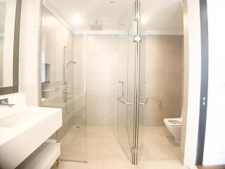 Modern bathroom with glass shower and toilet