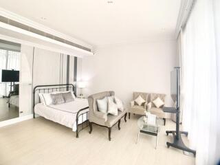 Spacious and bright bedroom with stylish furniture and modern amenities