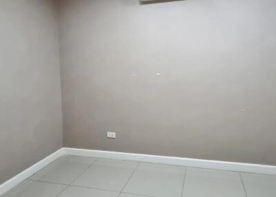 Empty room with tiled floor and neutral walls