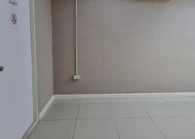 Empty room with door and electrical outlet