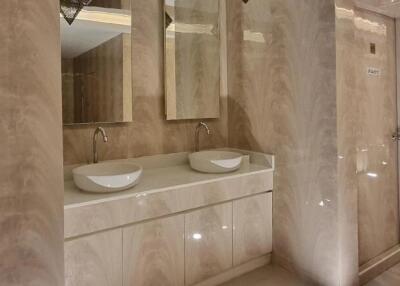 Modern bathroom with two sinks and large mirrors