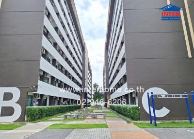 Exterior view of residential buildings with outdoor communal area