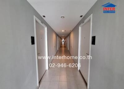 Long hallway with multiple doors in a modern building