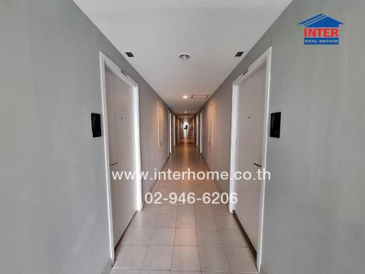 Long hallway with multiple doors in a modern building