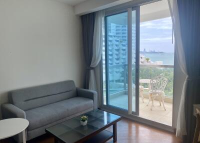 Modern living room with balcony and ocean view