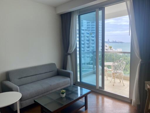 Modern living room with balcony and ocean view