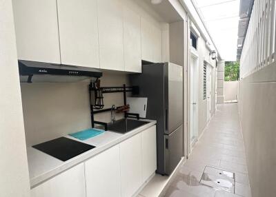 Modern kitchen with white cabinets and appliances