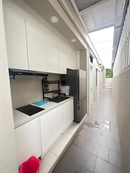 Modern kitchen with white cabinets and appliances