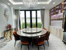 Elegant dining room with chandelier and round marble table