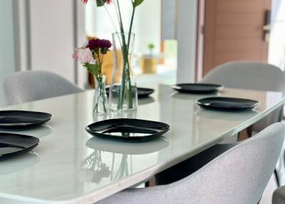 Modern dining room setup with table and chairs