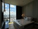 Modern bedroom with floor-to-ceiling windows and a city view