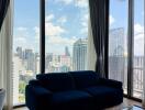 Modern living room with large glass windows and city view