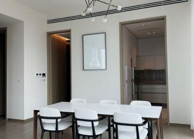 Modern dining room with a contemporary chandelier