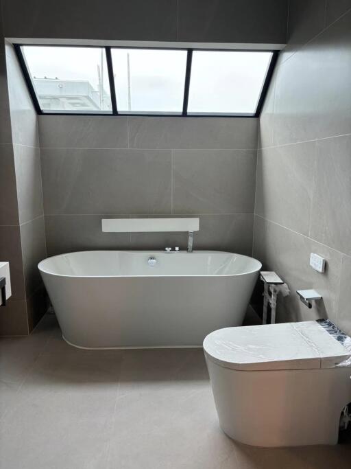 Modern bathroom with bathtub and toilet