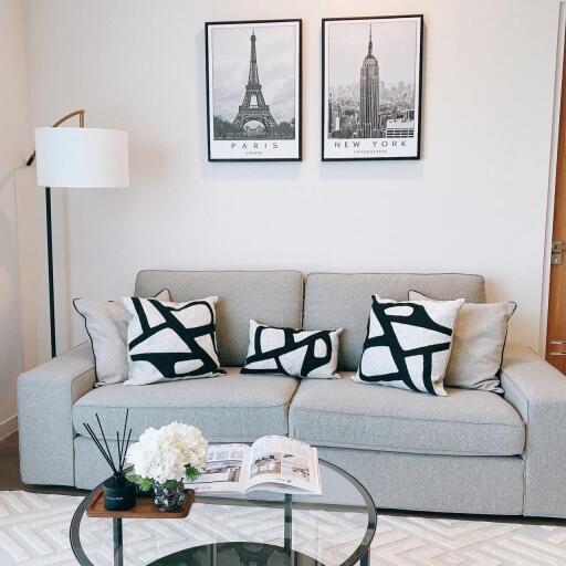 Modern living room with a grey sofa and decorative pillows