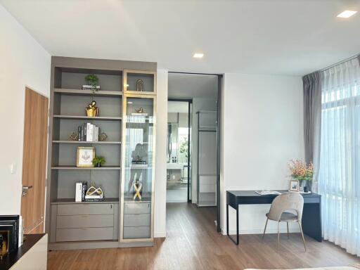 Modern bedroom with bookshelf and desk