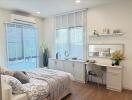 Bright and modern bedroom with a desk and large windows