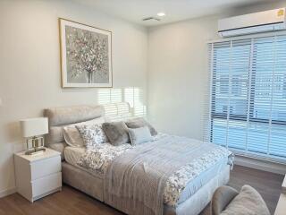 Modern bedroom with decor and natural light