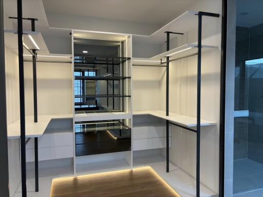 Spacious walk-in closet with modern design and ample storage