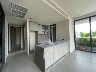 Modern kitchen with island and sliding glass doors