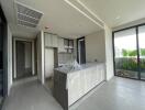 Modern kitchen with island and sliding glass doors