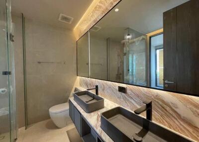 Modern bathroom with double sink and large mirror