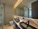 Modern bathroom with double sink and large mirror