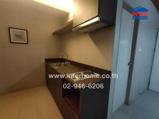 Modern kitchen with built-in cabinets and sink