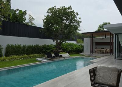 Modern outdoor area with pool and seating