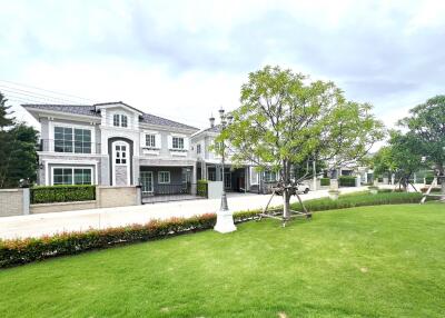 Exterior view of residential buildings with a well-manicured lawn