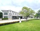 Exterior view of residential buildings with a well-manicured lawn