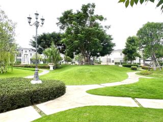 Well-maintained garden with lush greenery and walking paths