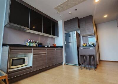 Modern kitchen with appliances and bar area