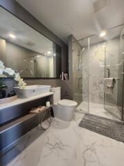 Modern bathroom with glass shower and marble floor