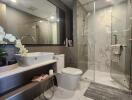 Modern bathroom with glass shower and marble floor