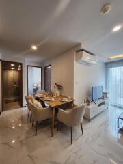 Modern living and dining area with marble flooring