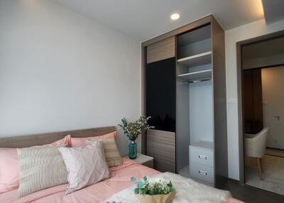 Cozy bedroom with modern decor and built-in closet