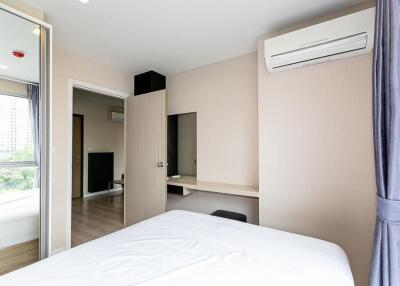 Modern bedroom with air conditioning and a large window