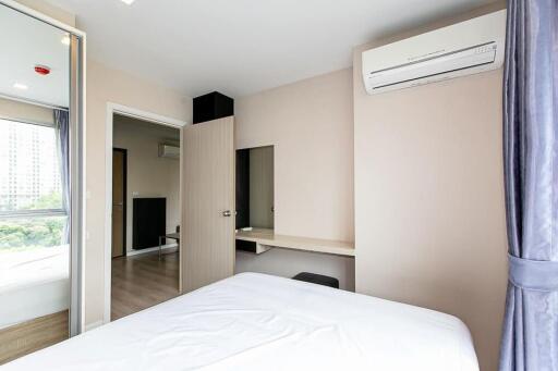 Modern bedroom with air conditioning and a large window