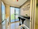 Modern kitchen with bar counter and a large window